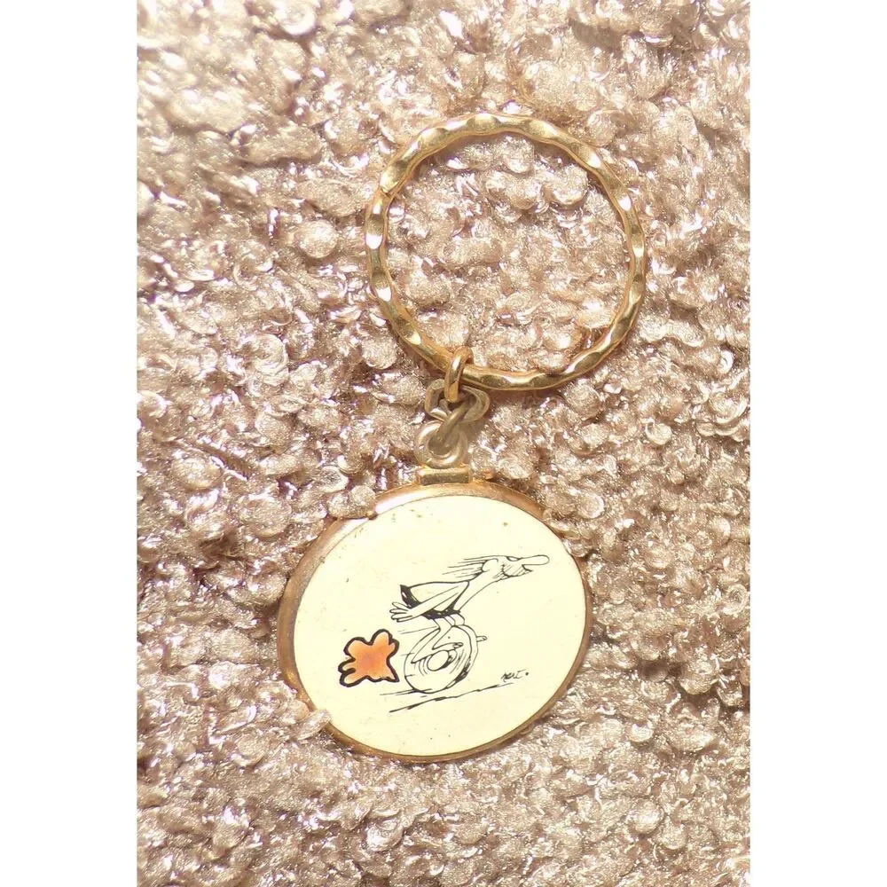 vintage metal BC comic caveman on wheel Keychain Key Ring